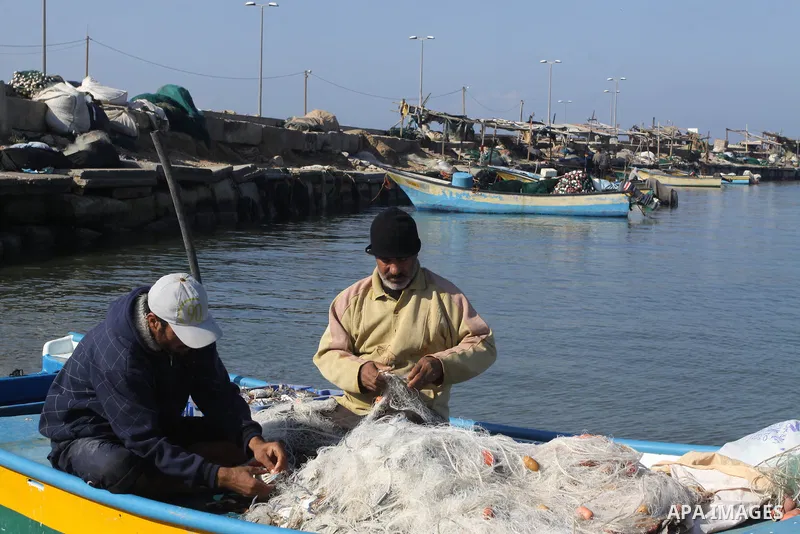 Palestinian fishermen prepare their boats in the port of Gaza on the Mediterranean coast, on Nov. 26, 2012, as a fragile truce between Israel and militant groups in Gaza enters its third day. Israel slammed Palestinian p...