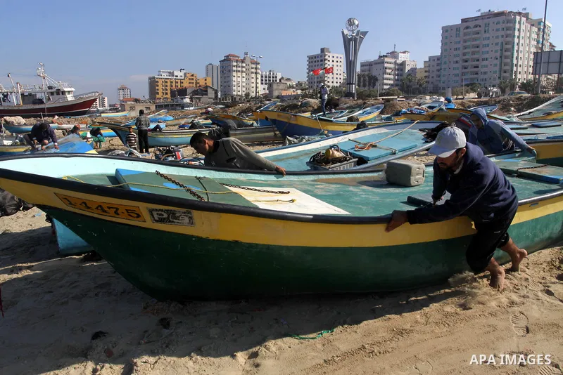 Palestinian fishermen prepare their boats in the port of Gaza on the Mediterranean coast, on Nov. 26, 2012, as a fragile truce between Israel and militant groups in Gaza enters its third day. Israel slammed Palestinian p...