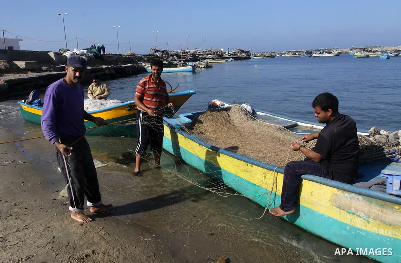 Palestinian fishermen prepare their boats in the port of Gaza on the Mediterranean coast, on Nov. 26, 2012, as a fragile truce between Israel and militant groups in Gaza enters its third day. Israel slammed Palestinian p...