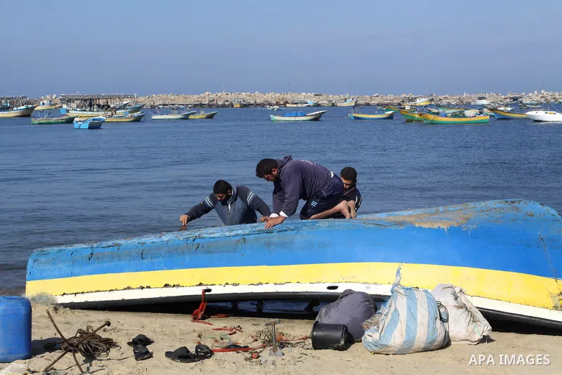 Palestinian fishermen prepare their boats in the port of Gaza on the Mediterranean coast, on Nov. 26, 2012, as a fragile truce between Israel and militant groups in Gaza enters its third day. Israel slammed Palestinian p...