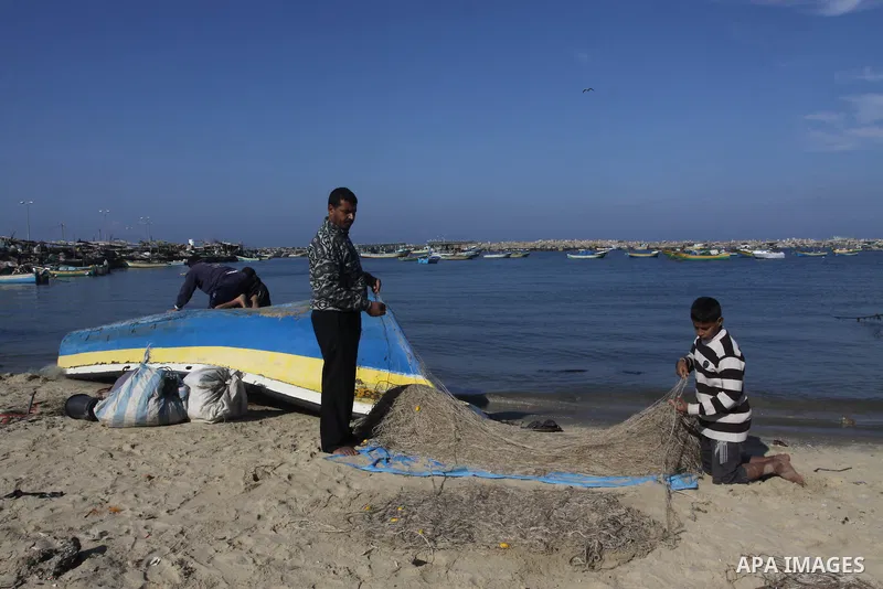 Palestinian fishermen prepare their boats in the port of Gaza on the Mediterranean coast, on Nov. 26, 2012, as a fragile truce between Israel and militant groups in Gaza enters its third day. Israel slammed Palestinian p...