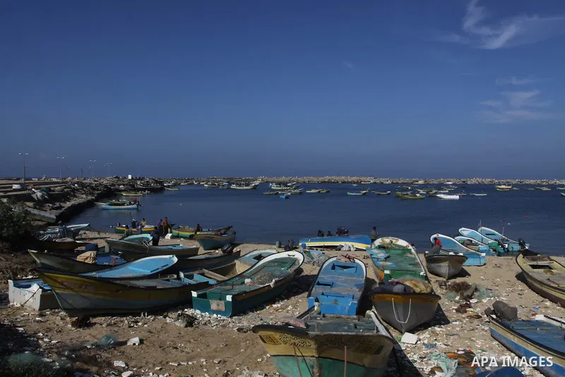 Palestinian fishermen prepare their boats in the port of Gaza on the Mediterranean coast, on Nov. 26, 2012, as a fragile truce between Israel and militant groups in Gaza enters its third day. Israel slammed Palestinian p...