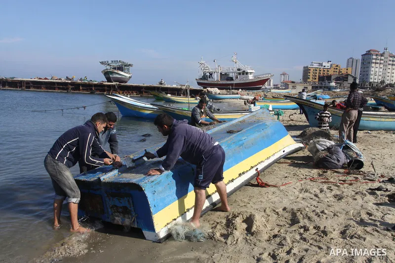 Palestinian fishermen prepare their boats in the port of Gaza on the Mediterranean coast, on Nov. 26, 2012, as a fragile truce between Israel and militant groups in Gaza enters its third day. Israel slammed Palestinian p...