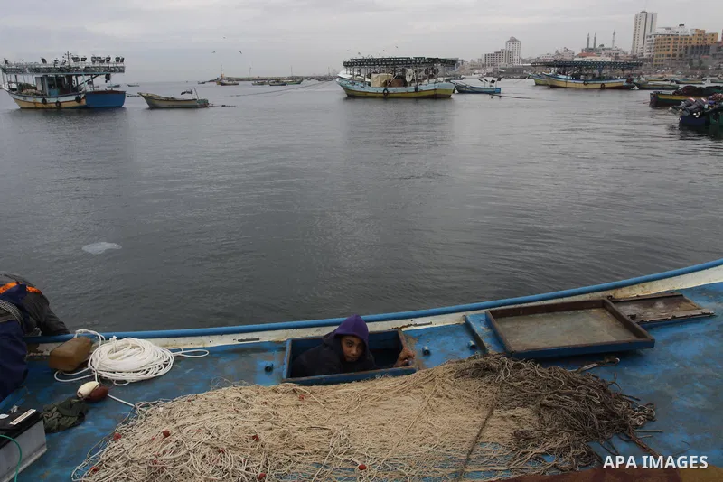 Palestinian fishermen prepare their boats in the port of Gaza on the Mediterranean coast, on November 27, 2012. Israel eased restrictions on Gaza fishermen on Saturday, further implementing truce brokered by Egypt after...