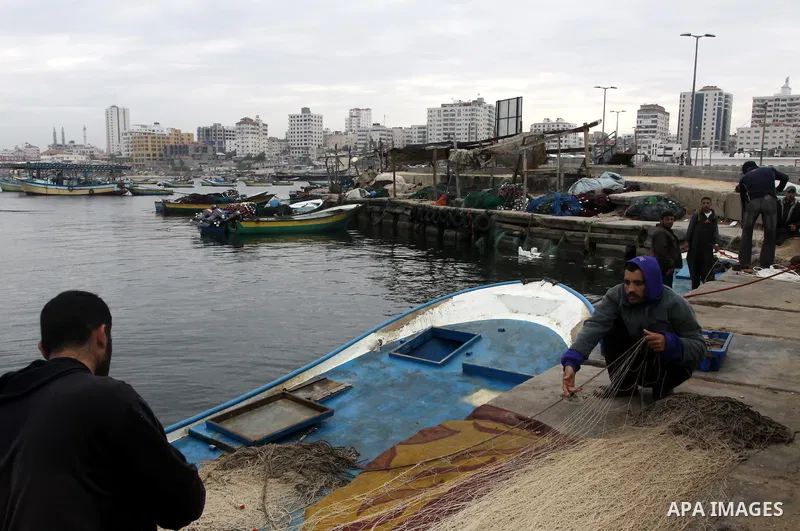 Palestinian fishermen prepare their boats in the port of Gaza on the Mediterranean coast, on November 27, 2012. Israel eased restrictions on Gaza fishermen on Saturday, further implementing truce brokered by Egypt after...