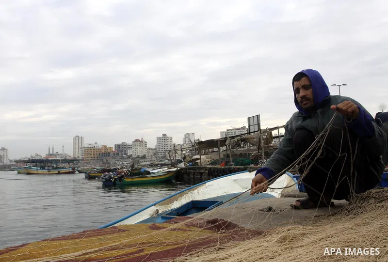 Palestinian fishermen prepare their boats in the port of Gaza on the Mediterranean coast, on November 27, 2012. Israel eased restrictions on Gaza fishermen on Saturday, further implementing truce brokered by Egypt after...