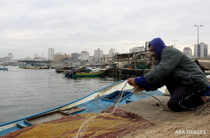 Palestinian fishermen prepare their boats in the port of Gaza on the Mediterranean coast, on November 27, 2012. Israel eased restrictions on Gaza fishermen on Saturday, further implementing truce brokered by Egypt after...