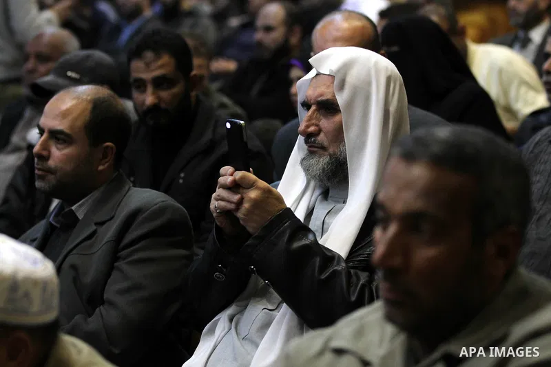 Palestinians listen to the speech of Prime Minister in Gaza strip Ismail Haniyeh during a ceremony to honor the families of martyrs in Gaza city on November 27, 2012. Israeli aircraft killed 166 including scores of civil...