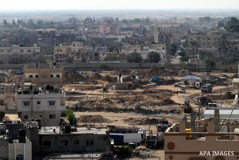 Palestinians work at the entrance of a smuggling tunnels dug beneath the Egyptian-Gaza border in Rafah, in the southern Gaza Strip November 27, 2012. Knee-deep in craters carved out by Israeli air strikes, Palestinians w...