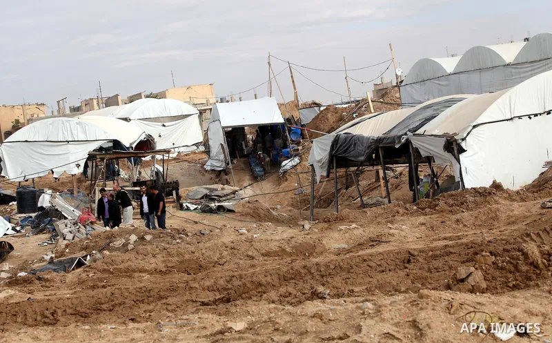 Palestinians work at the entrance of a smuggling tunnels dug beneath the Egyptian-Gaza border in Rafah, in the southern Gaza Strip November 27, 2012. Knee-deep in craters carved out by Israeli air strikes, Palestinians w...