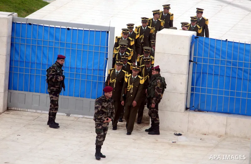 Members of a Palestinian honour guard leave after a wreath laying ceremony near the grave of the late leader Yasser Arafat, in the West Bank city of Ramallah, November 27, 2012. Forensic experts took samples from Arafat'...