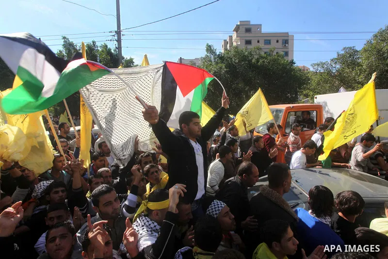 Palestinians take part in a rally in support of the efforts of President Mahmoud Abbas (pictured in poster) to secure a diplomatic upgrade at the United Nations, in Gaza City November 29, 2012. The U.N. General Assembly...