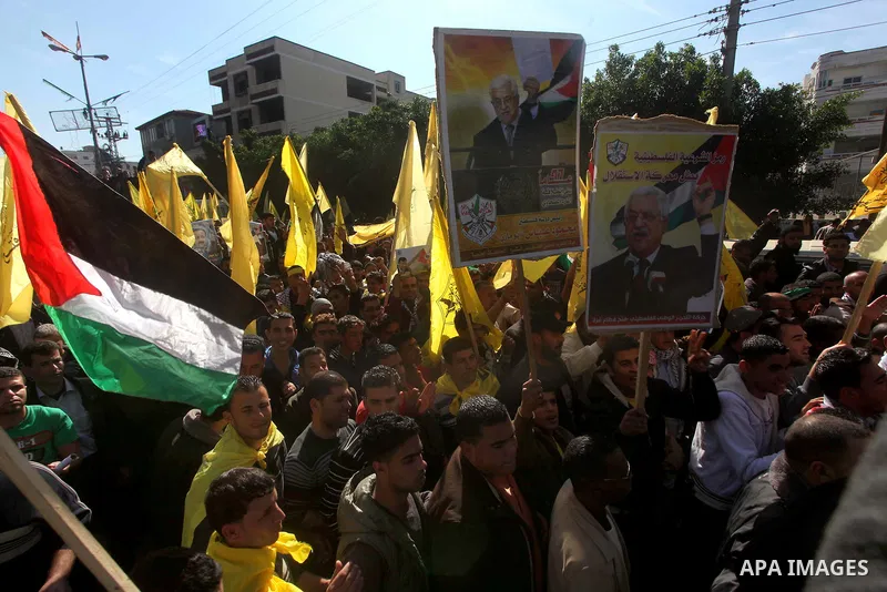 Palestinians take part in a rally in support of the efforts of President Mahmoud Abbas (pictured in poster) to secure a diplomatic upgrade at the United Nations, in Gaza City November 29, 2012. The U.N. General Assembly...