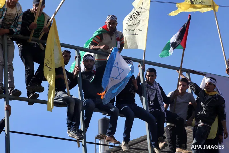 Palestinians take part in a rally in support of the efforts of President Mahmoud Abbas (pictured in poster) to secure a diplomatic upgrade at the United Nations, in Gaza City November 29, 2012. The U.N. General Assembly...