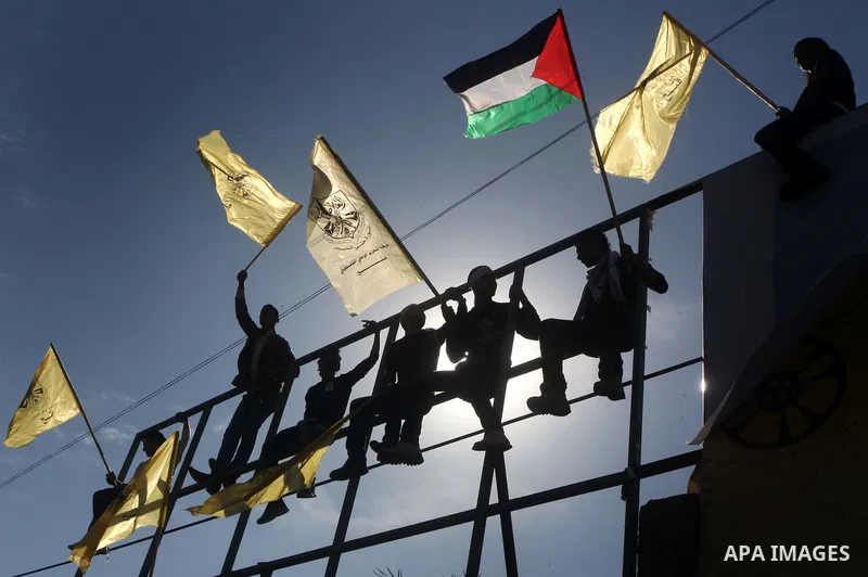 Palestinians take part in a rally in support of the efforts of President Mahmoud Abbas (pictured in poster) to secure a diplomatic upgrade at the United Nations, in Gaza City November 29, 2012. The U.N. General Assembly...