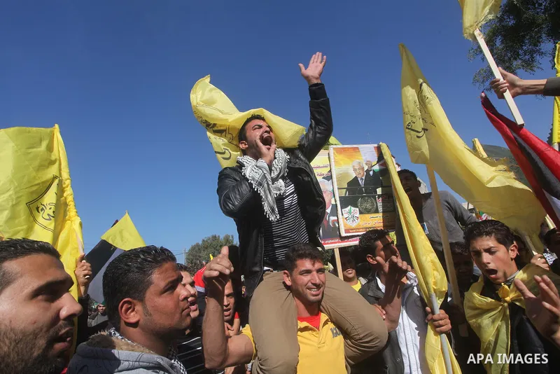 Palestinians take part in a rally in support of the efforts of President Mahmoud Abbas (pictured in poster) to secure a diplomatic upgrade at the United Nations, in Gaza City November 29, 2012. The U.N. General Assembly...