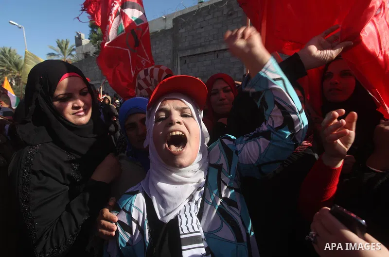 Palestinians take part in a rally in support of the efforts of President Mahmoud Abbas (pictured in poster) to secure a diplomatic upgrade at the United Nations, in Gaza City November 29, 2012. The U.N. General Assembly...