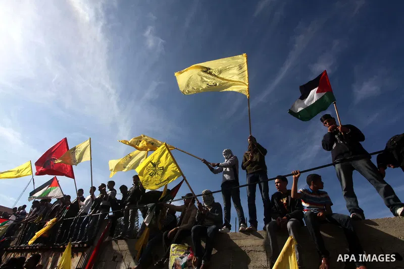 Palestinians take part in a rally in support of the efforts of President Mahmoud Abbas (pictured in poster) to secure a diplomatic upgrade at the United Nations, in Gaza City November 29, 2012. The U.N. General Assembly...
