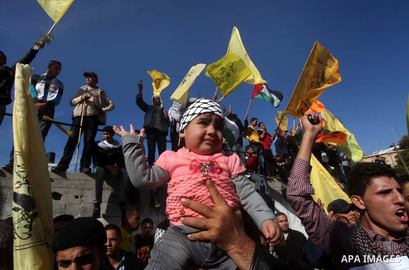 Palestinians take part in a rally in support of the efforts of President Mahmoud Abbas (pictured in poster) to secure a diplomatic upgrade at the United Nations, in Gaza City November 29, 2012. The U.N. General Assembly...