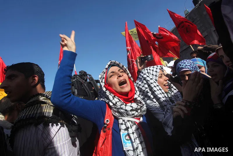 Palestinians take part in a rally in support of the efforts of President Mahmoud Abbas (pictured in poster) to secure a diplomatic upgrade at the United Nations, in Gaza City November 29, 2012. The U.N. General Assembly...