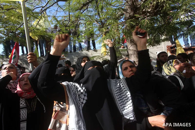 Palestinians take part in a rally in support of the efforts of President Mahmoud Abbas (pictured in poster) to secure a diplomatic upgrade at the United Nations, in Gaza City November 29, 2012. The U.N. General Assembly...