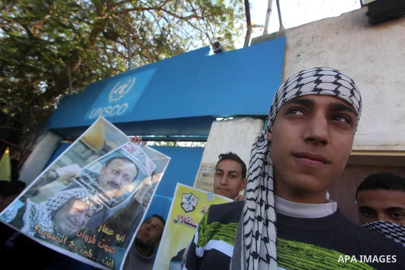 Palestinians take part in a rally in support of the efforts of President Mahmoud Abbas (pictured in poster) to secure a diplomatic upgrade at the United Nations, in Gaza City November 29, 2012. The U.N. General Assembly...