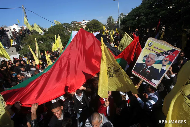 Palestinians take part in a rally in support of the efforts of President Mahmoud Abbas (pictured in poster) to secure a diplomatic upgrade at the United Nations, in Gaza City November 29, 2012. The U.N. General Assembly...