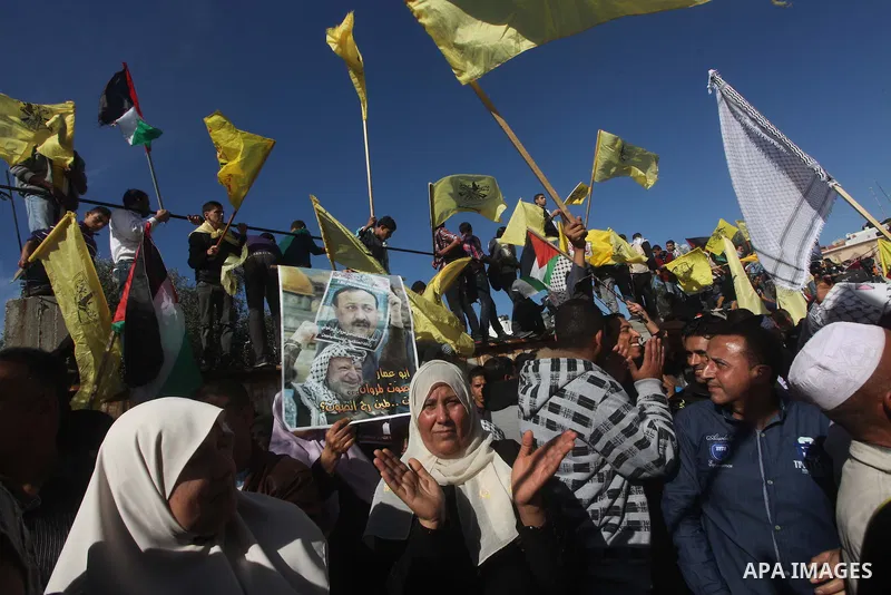 Palestinians take part in a rally in support of the efforts of President Mahmoud Abbas (pictured in poster) to secure a diplomatic upgrade at the United Nations, in Gaza City November 29, 2012. The U.N. General Assembly...