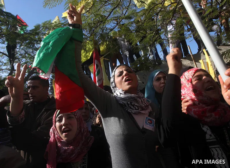 Palestinians take part in a rally in support of the efforts of President Mahmoud Abbas (pictured in poster) to secure a diplomatic upgrade at the United Nations, in Gaza City November 29, 2012. The U.N. General Assembly...