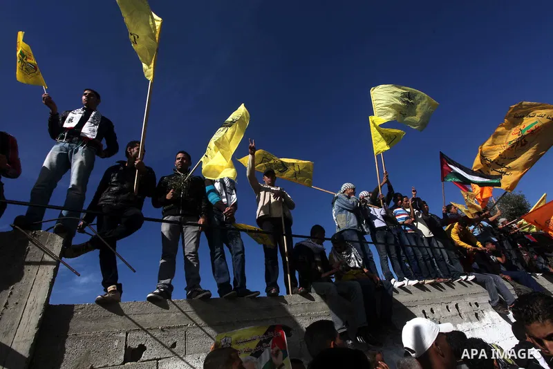 Palestinians take part in a rally in support of the efforts of President Mahmoud Abbas (pictured in poster) to secure a diplomatic upgrade at the United Nations, in Gaza City November 29, 2012. The U.N. General Assembly...