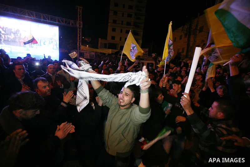 Palestinians celebrate in the West Bank city of Hebron on November 29, 2012 after the General Assembly voted to recognise Palestine as a non-member state. The UN General Assembly on Thursday voted overwhelmingly to recog...