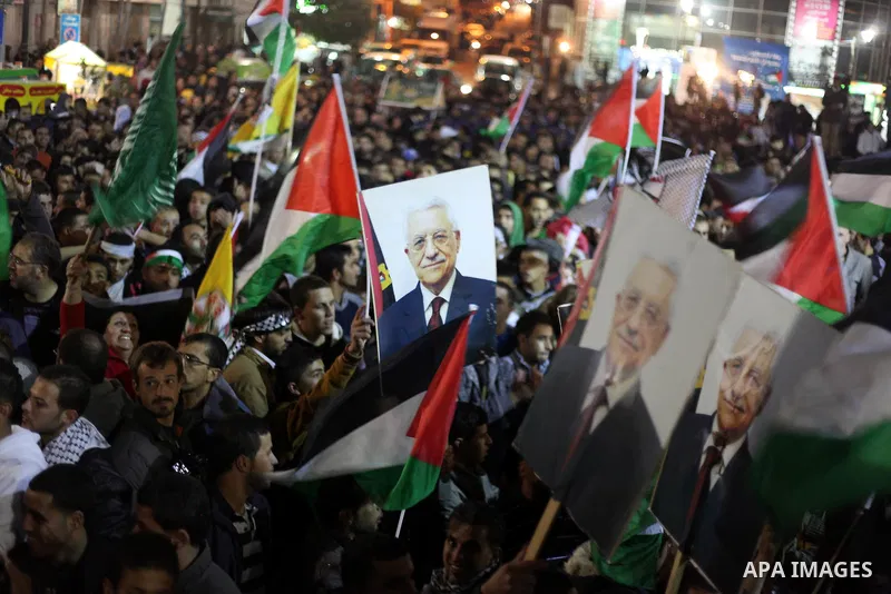 Palestinians celebrate in the West Bank city of Hebron on November 29, 2012 after the General Assembly voted to recognise Palestine as a non-member state. The UN General Assembly on Thursday voted overwhelmingly to recog...