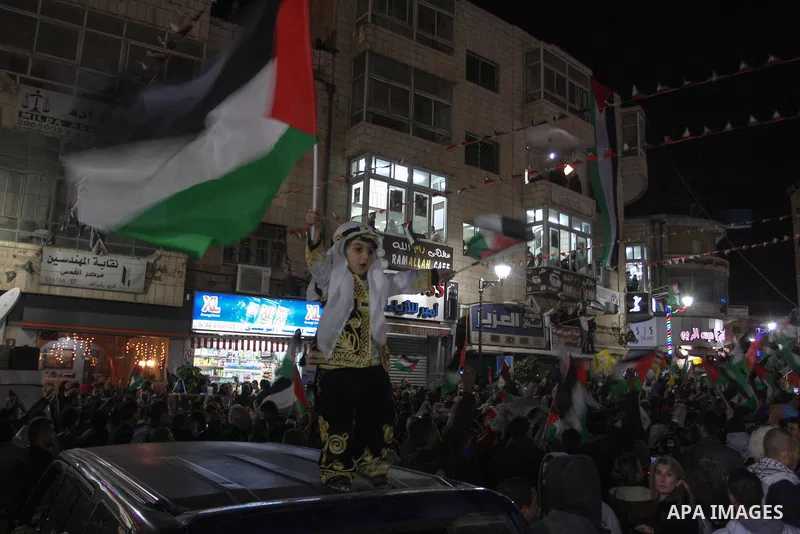 Palestinians celebrate in the West Bank city of Hebron on November 29, 2012 after the General Assembly voted to recognise Palestine as a non-member state. The UN General Assembly on Thursday voted overwhelmingly to recog...