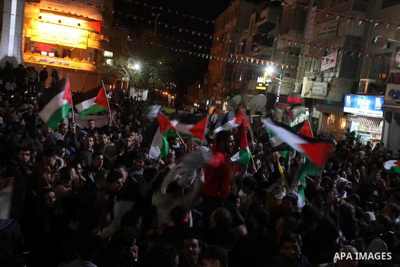 Palestinians celebrate in the West Bank city of Hebron on November 29, 2012 after the General Assembly voted to recognise Palestine as a non-member state. The UN General Assembly on Thursday voted overwhelmingly to recog...