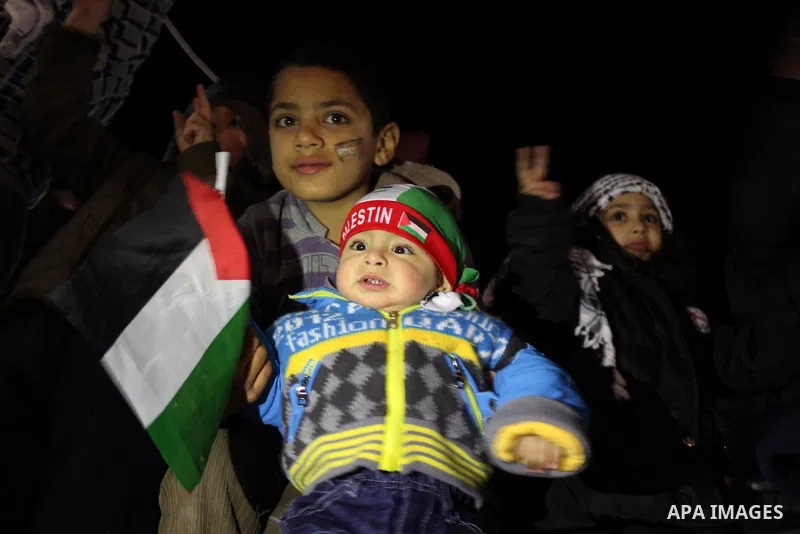 Palestinians celebrate in the West Bank city of Hebron on November 29, 2012 after the General Assembly voted to recognise Palestine as a non-member state. The UN General Assembly on Thursday voted overwhelmingly to recog...