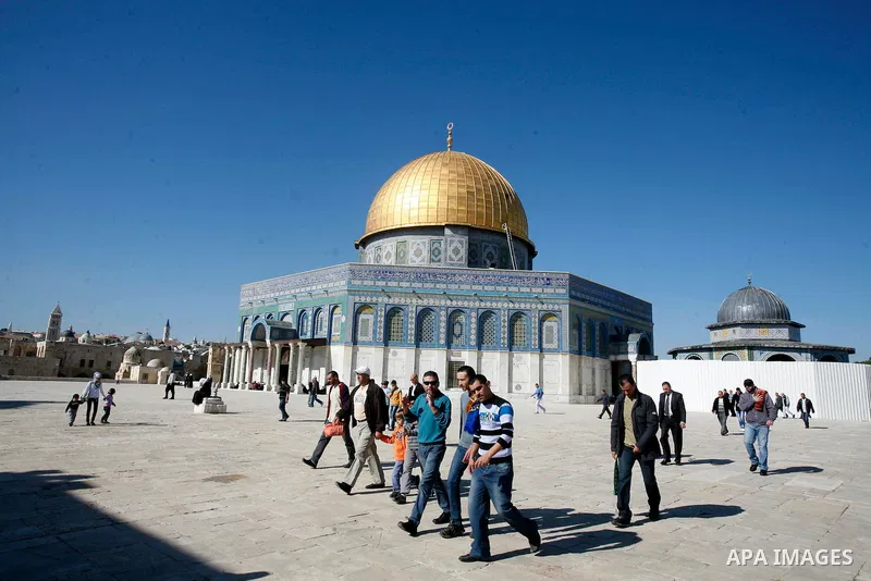 Palestinians walk at the al-Aqsa mosque compound following the Friday prayer in Jerusalem's old city on November 30, 2012. Photo by Mahfouz Abu Turk