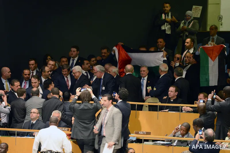 Palestinian President Mahmoud Abbas gets congratulated at the UN General Assembly meeting at the UN headquarters, in New York, November 29, 2012. Abbas appealed to the U.N. General Assembly to recognize Palestinian state...