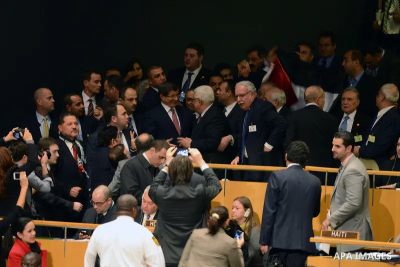 Palestinian President Mahmoud Abbas gets congratulated at the UN General Assembly meeting at the UN headquarters, in New York, November 29, 2012. Abbas appealed to the U.N. General Assembly to recognize Palestinian state...