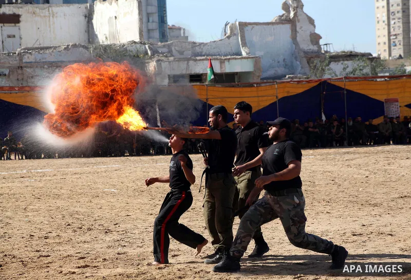 Interior Ministry officers demonstrate their skills during a graduation ceremony from a military course in Gaza city on Dec. 02, 2012. Photo by Ashraf Amra