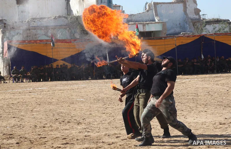 Interior Ministry officers demonstrate their skills during a graduation ceremony from a military course in Gaza city on Dec. 02, 2012. Photo by Ashraf Amra