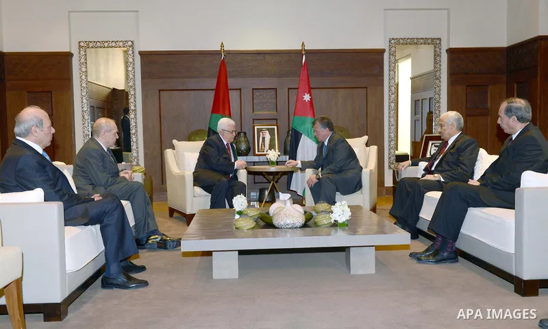 Palestinian President Mahmoud Abbas (L) meets with Jordan King Abdullah II (R) at the Royal Palace in Amman, 02 December 2012. Abbas stopped in Jordan on his way to Ramallah from New york after a vote on a resolution to...