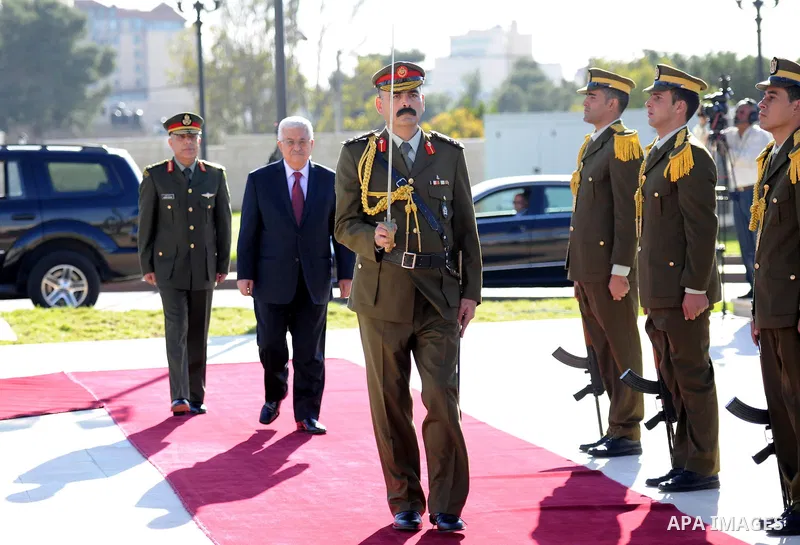 Palestinian President Mahmoud Abbas is greated by honor guards as he arrives to the West Bank city of Ramallah on December 2, 2012. Abbas arrived to the West Bank after a vote on a resolution to upgrade the status of the...