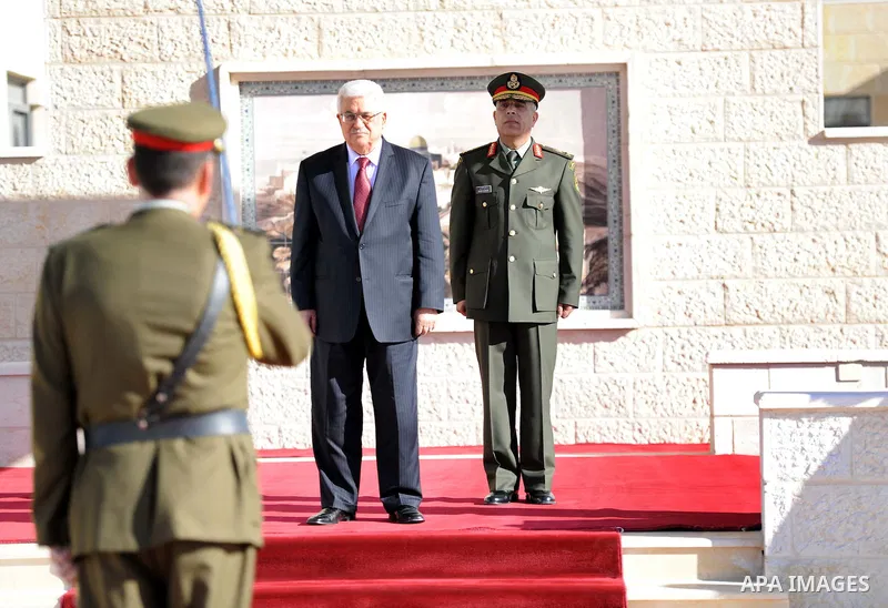Palestinian President Mahmoud Abbas is greated by honor guards as he arrives to the West Bank city of Ramallah on December 2, 2012. Abbas arrived to the West Bank after a vote on a resolution to upgrade the status of the...