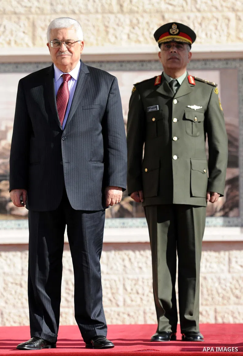 Palestinian President Mahmoud Abbas is greated by honor guards as he arrives to the West Bank city of Ramallah on December 2, 2012. Abbas arrived to the West Bank after a vote on a resolution to upgrade the status of the...