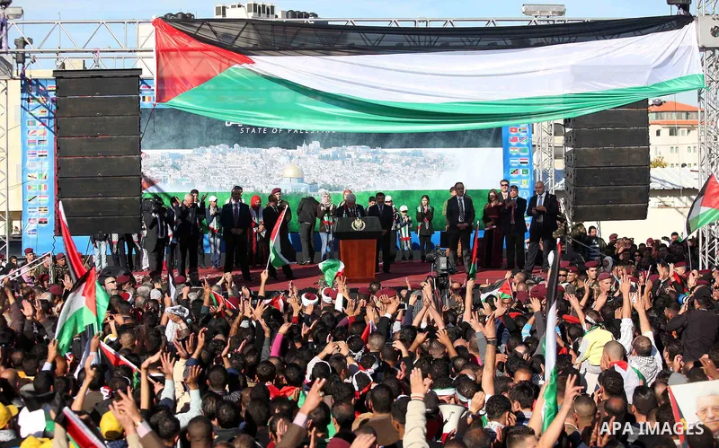 Palestinian President Mahmoud Abbas speaks as Palestinians celebrate their successful bid for UN non-member observer state status, in the West Bank city of Ramallah on December 2, 2012, Abbas arrived to the West Bank aft...