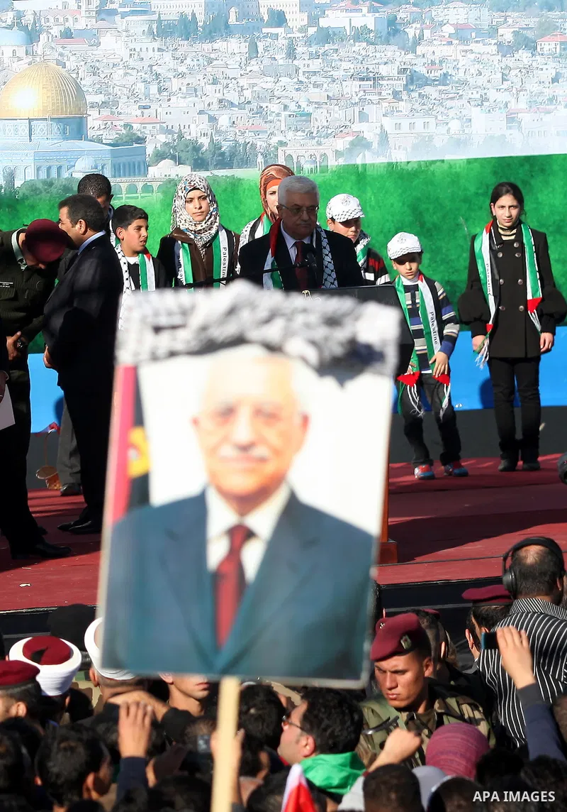 Palestinian President Mahmoud Abbas speaks as Palestinians celebrate their successful bid for UN non-member observer state status, in the West Bank city of Ramallah on December 2, 2012, Abbas arrived to the West Bank aft...