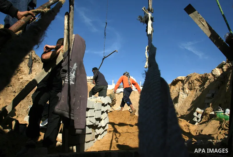 Palestinian labourers repair a bombed smuggling tunnel linking the Gaza Strip to Egypt, in Rafah, on December 2, 2012. Israeli airforce jets bombed most of the smuggling tunnels in the southern Gaza Strip during its war...