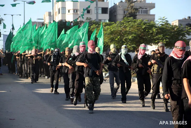 Palestinian members of al-Qassam brigades, the armed wing of the Hamas movement, take part in an anti-Israel parade in Gaza City December 2, 2012. Eight days of Israeli air strikes on Gaza and cross-border Palestinian ro...