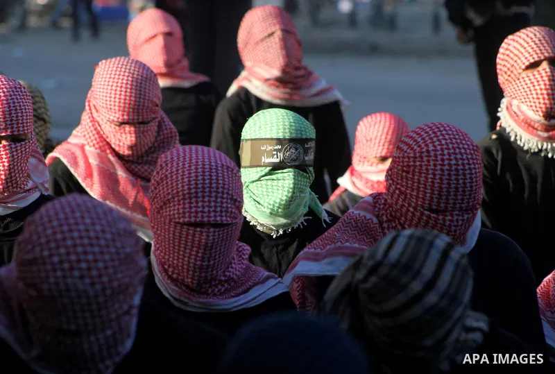 Palestinian members of al-Qassam brigades, the armed wing of the Hamas movement, take part in an anti-Israel parade in Gaza City December 2, 2012. Eight days of Israeli air strikes on Gaza and cross-border Palestinian ro...