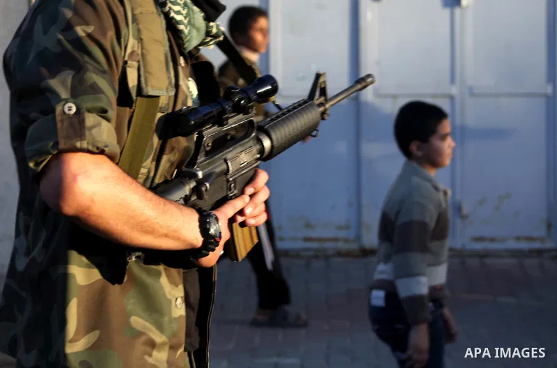 Palestinian members of al-Qassam brigades, the armed wing of the Hamas movement, take part in an anti-Israel parade in Gaza City December 2, 2012. Eight days of Israeli air strikes on Gaza and cross-border Palestinian ro...